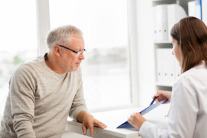 senior man talking to his doctor